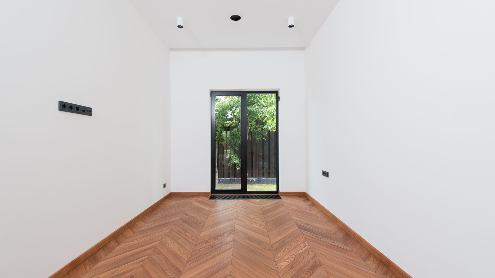 Warm wood flooring and a bright interior, representative stock photography
